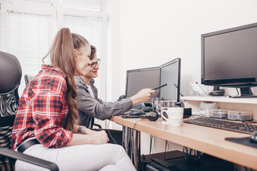 Colleagues using desktop computers