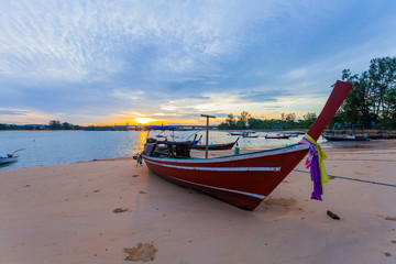 Naklejka na ściany i meble sunrise above Sarasin bridge fishing boats are parking on the beach