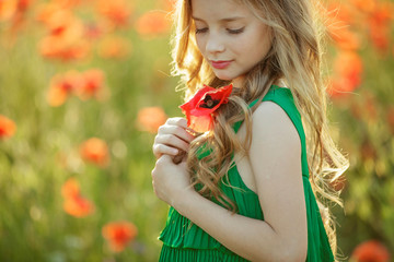 Children in a field with flowers  