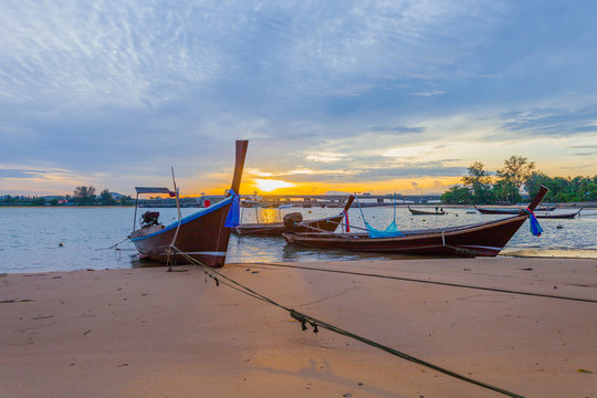 sunrise above Sarasin bridge fishing boats are parking on the beach