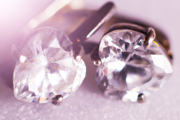Obraz na płótnie Canvas Silver earrings with diamonds