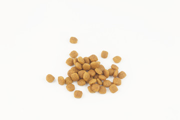 Dry one color kibble dog or cat food on isolated white background.