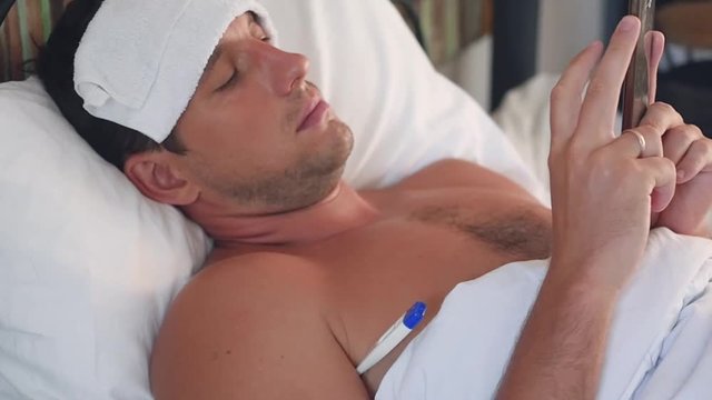 A Businessman Lies In A Hospital With A Temperature And Works Through A Mobile Phone. Slow Motion, 1920x1080, Full Hd