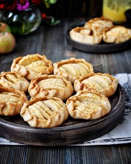 Obraz na płótnie Canvas Slices of fresh apples baked in dough. With sesame seeds