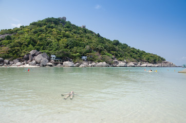 tourists swimming in the sea of a tropical resort, Thailand