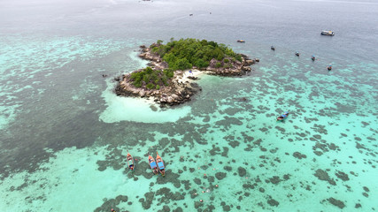 Bird’s eye view of tropical beach with crystal clear turquoise water on 'Koh Kra' island, Koh Lipe,Thailand