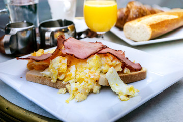 Breakfast with orange juice and fresh fruits on table