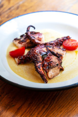 Mediterranean Octopus with vegetables and potatoes