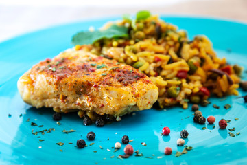 Andalusian fish, saffron rice with vegetables