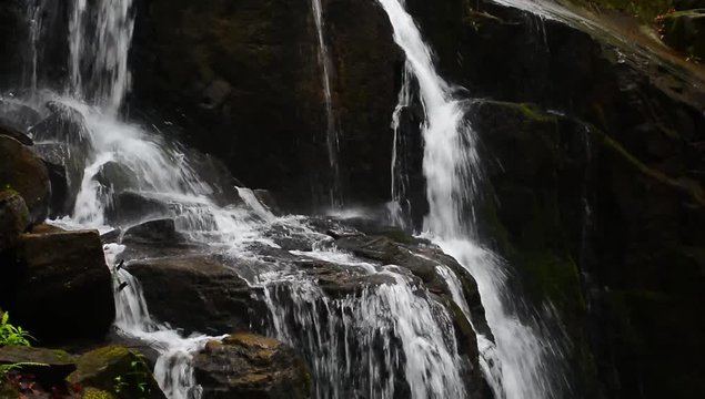 water flow on rocks of Skakalo waterfall. beautiful summer scenery of Carpathian nature. closeup detail view with polarizing effect