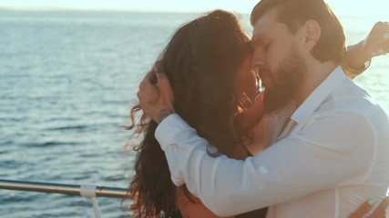 Energetic attractive young hispanic couple dancing latin Bachata near sea or ocean. Sunlight background. Summer time, romantic footage. Slow motion.
