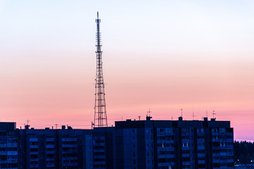 TV tower in the background of the city and sunset
