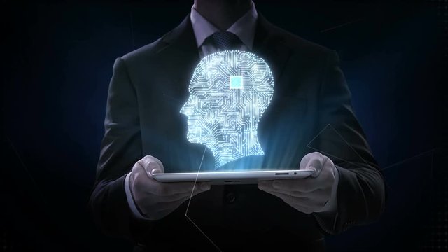 Businessman lifting smart pad, tablet, CPU chip circuit board connected human head shape, 4K movie.grow artificial intelligence. 2.