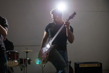 Rock band guitarist on stage