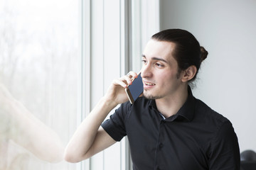 Young Businessman in Talking on a Cellphone