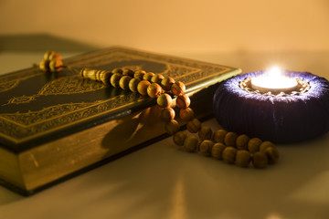 Koran and rosary on the wooden lectern  for Islamic concept. Holy book quran for Muslims for eleven...