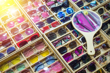Sunglass shop and different apparel for eyes with colorful accessories and trendy lenses.