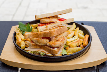 Chicken sandwich in toast bread, with French fries as a bowl, on a white background, restaurant, served