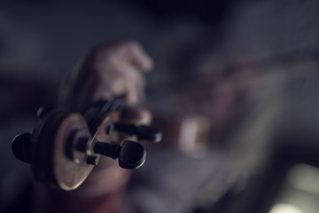 Retro toned image of playing a violin