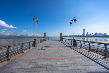 city skyline with empty floor in urban square