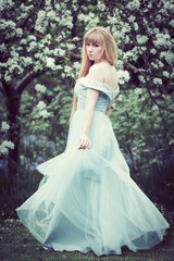 Woman Standing In Apple Blossom