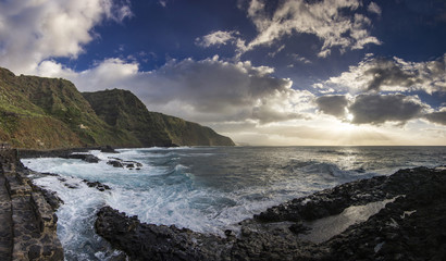 sunset on tenerife island with view on ocean with waves