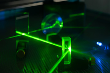 Experiment in photonic laboratory with laser - obrazy, fototapety, plakaty