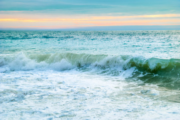Sea landscape with big waves and sunset