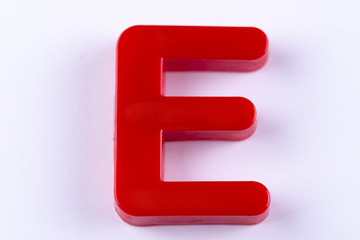letter E uppercase alphabet isolated made of plastic on white background with shadows