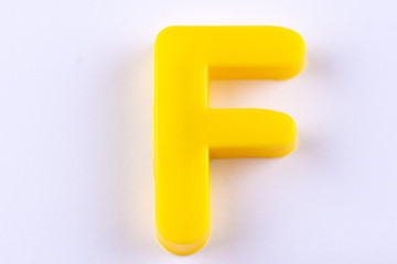 letter F uppercase alphabet isolated made of plastic on white background with shadows