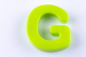 letter G uppercase alphabet isolated made of plastic on white background with shadows