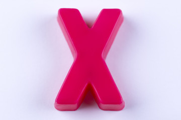 letter X uppercase alphabet isolated made of plastic on white background with shadows