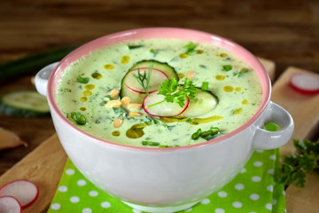 Cold soup Tarator with yogurt, radish, cucumber, greenery and pine nuts. Meal of Bulgarian cuisine
