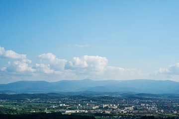panorama view of the valley (city) at the foot of the mountains in the distance