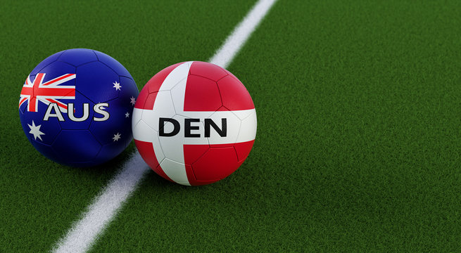 Denmark vs. Australia Soccer Match - Soccer balls in Australia and Denmarks national colors on a soccer field. Copy space on the right side - 3D Rendering 