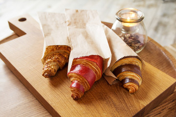 fresh croissants with jam and almonds for breakfast