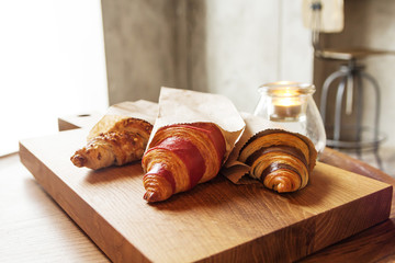 fresh croissants with jam and almonds for breakfast