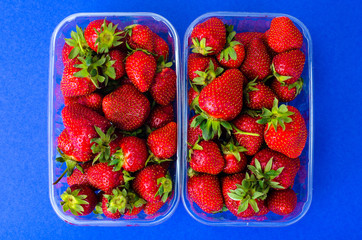 Plastic container with fresh strawberries
