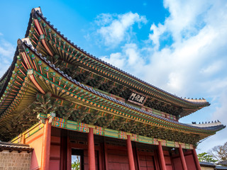  The main gate at Changdeokgung Palace blue sky is a famous tourist attraction in Seoul, South...