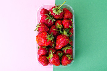 Plastic container with fresh strawberries