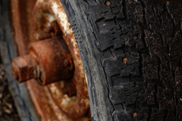 Old wheel tire on a rusty disk