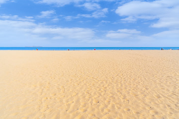 The sea and sand under a clear sky