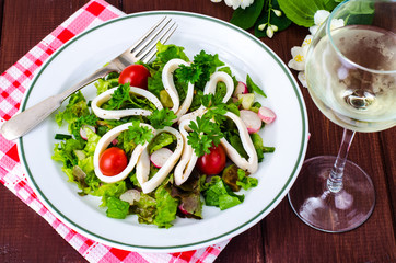 Dishes with seafood. Salad with squid