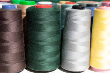 A set of colorful threads for sewing. Close up