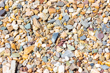 Texture of rubble, colored stones, background, natural material