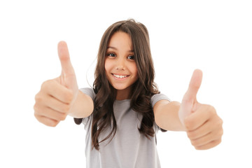 Pretty cute girl showing thumbs up gesture.