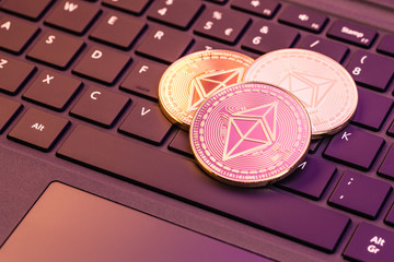 Ethereum coins on computer keyboard