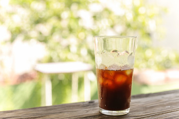 Iced coffee black coffee isolated on green
