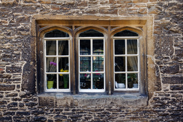 Old stone wall with windows
