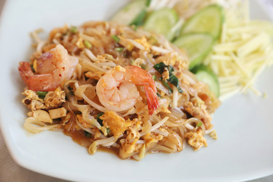 Shrimp pad thai noodles with shrimps on top , Thai food